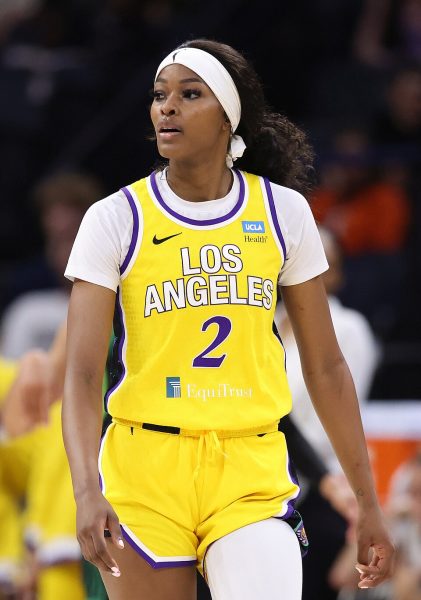 Rickea Jackson stands in yellow and purple Los Angeles Sparks uniform, wearing #2.